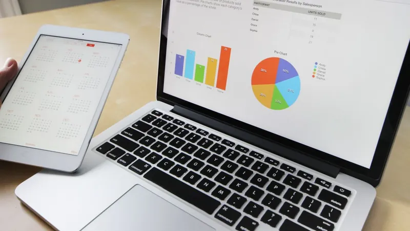 Laptop and tablet showing search performance charts and SEO reporting dashboards